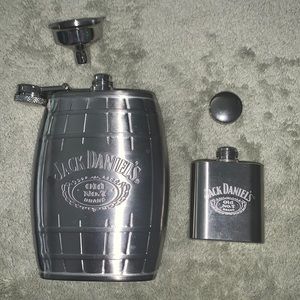 Two Jack Daniels flasks: one 6 oz and one 1 oz.